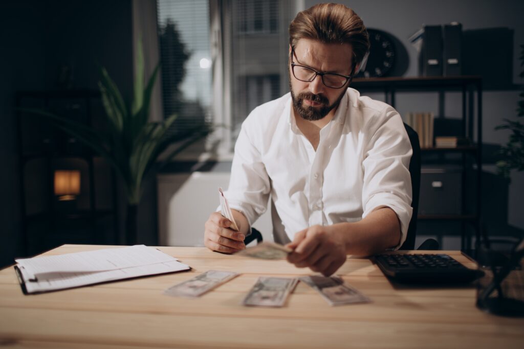 man counting money