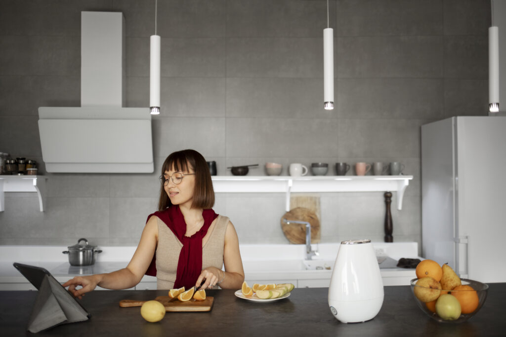 woman using smart technology in kitchen